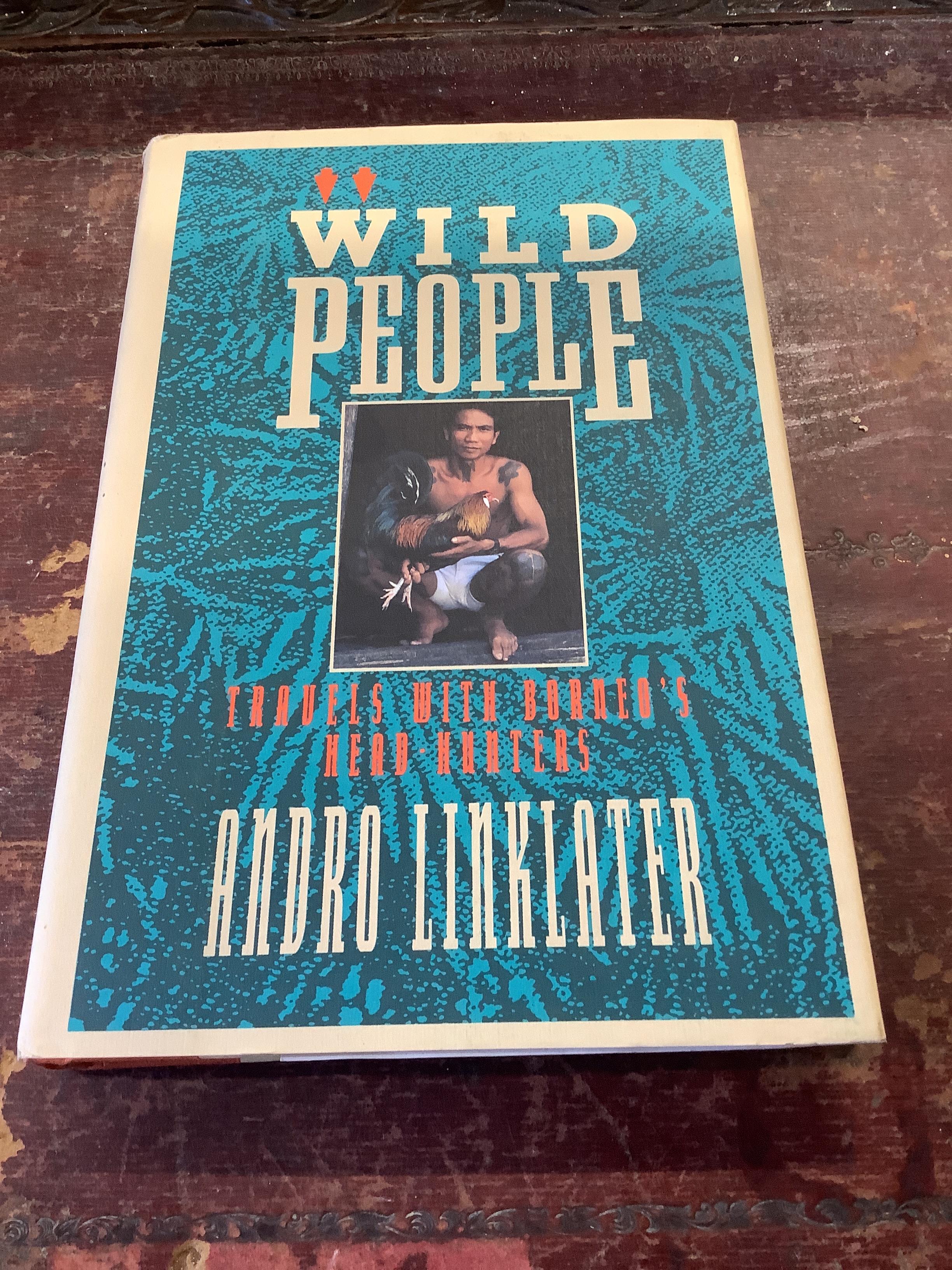 A Sarawak Iban people chair, height 87cm and a book 'Wild People'